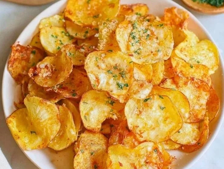 Delicious air fryer potato chips served in a bowl, crispy and golden brown.