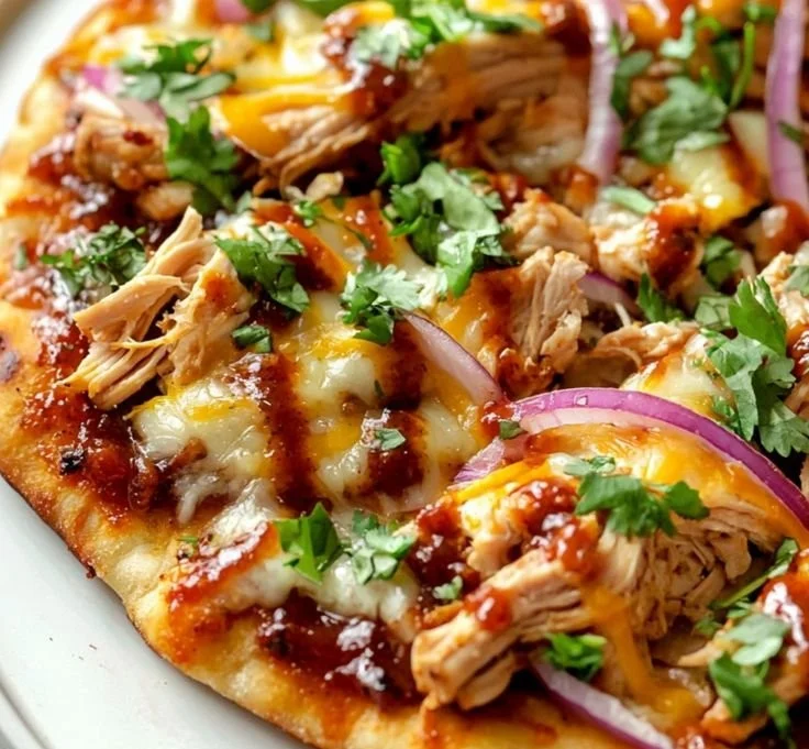 BBQ Chicken Flatbread topped with fresh ingredients and drizzled with barbecue sauce