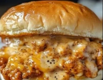 Delicious Cajun Chicken Sloppy Joes served on a bun with colorful toppings.