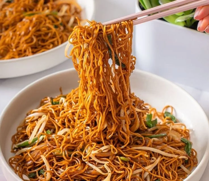 Delicious bowl of Classic Chinese Stir-Fried Noodles with colorful vegetables