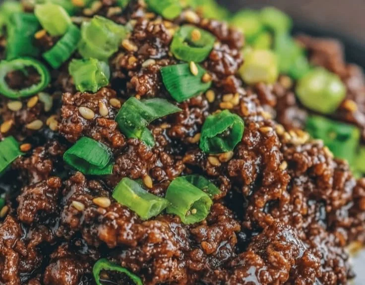 Korean Ground Beef Bowl topped with fresh vegetables and sesame seeds