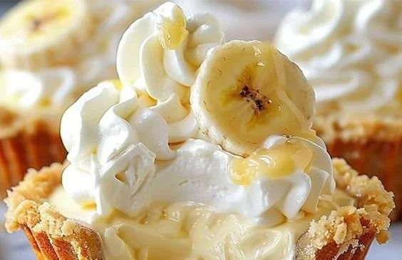 No-bake mini banana cream pies in serving dishes, topped with whipped cream