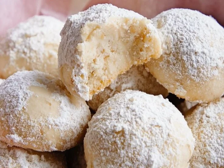 Soft homemade snowball cookies dusted with powdered sugar