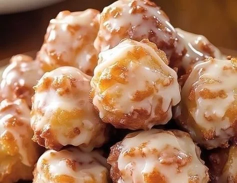 Deliciously baked apple fritters topped with glaze and cinnamon